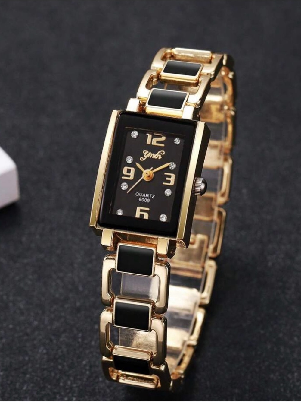 Black and gold watch